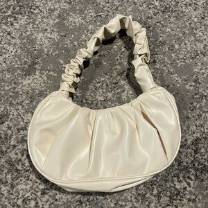 Faux leather purse with ruffled strap